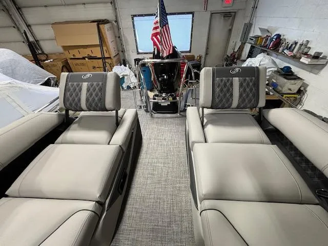 Slide: The Image of 2024 Barletta Lusso 23M interior with luxurious seating in a workshop. - 12