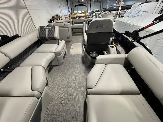 Slide: The Image of 2024 Barletta Lusso 23M pontoon boat interior with luxurious seating and modern design. - 19