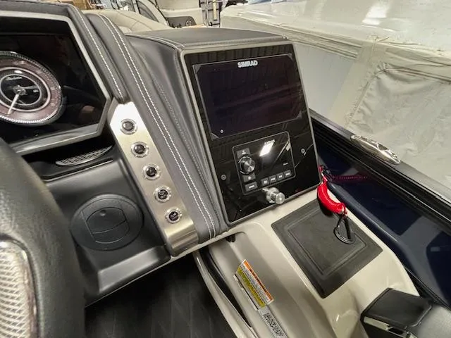 Slide: The Image of 2024 Barletta Lusso 23M dashboard with Simrad display and control panel. - 22