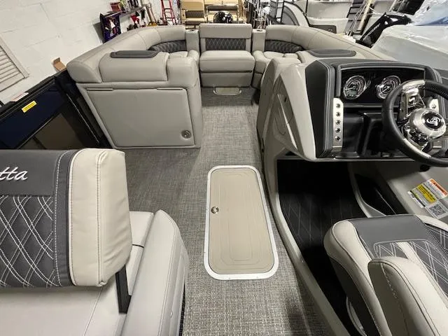 Slide: The Image of 2024 Barletta Lusso 23M interior with luxurious seating and modern dashboard. - 24