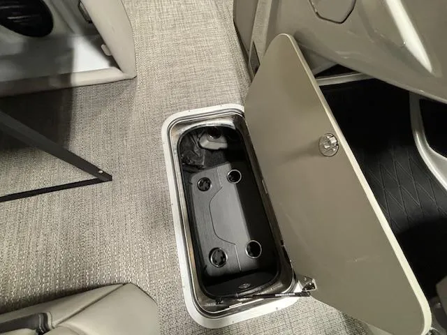 Slide: The Image of Barletta Lusso 23M 2024 storage compartment with open hatch on carpeted floor. - 25