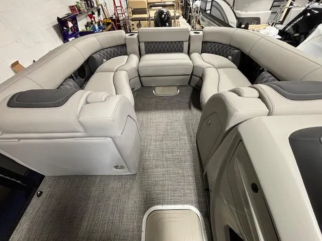 Slide: The Image of 2024 Barletta Lusso 23M luxury pontoon boat interior with plush seating. - 27