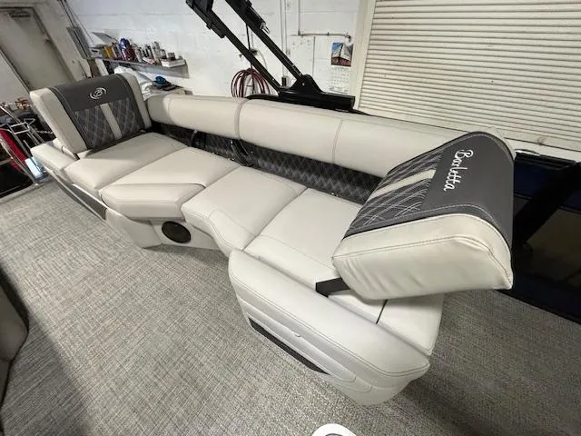 Slide: The Image of 2024 Barletta Lusso 23M luxury boat interior with plush seating and modern design. - 9