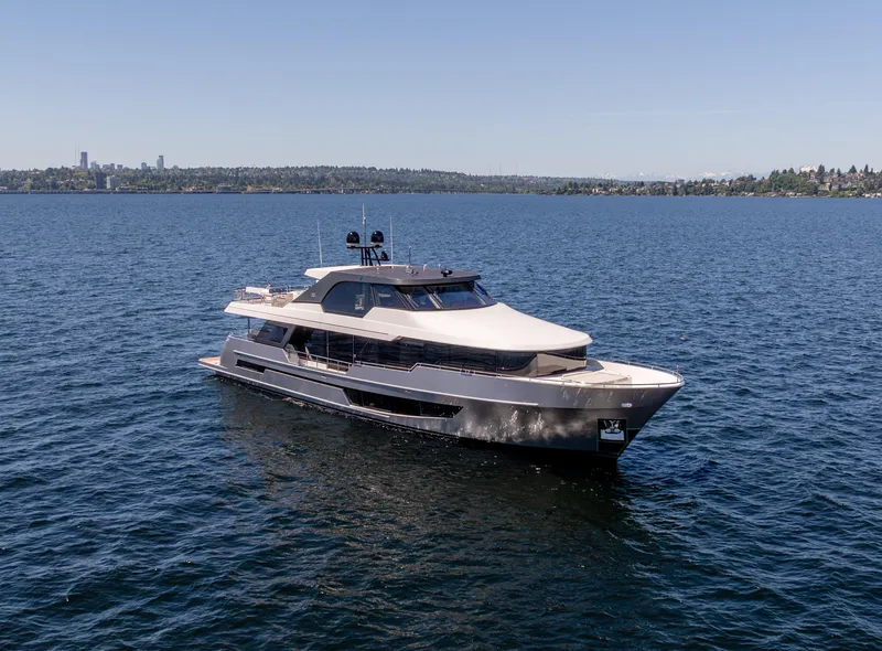 Slide: The Image of 2024 Ocean Alexander 32L luxury yacht cruising on open water. - 1
