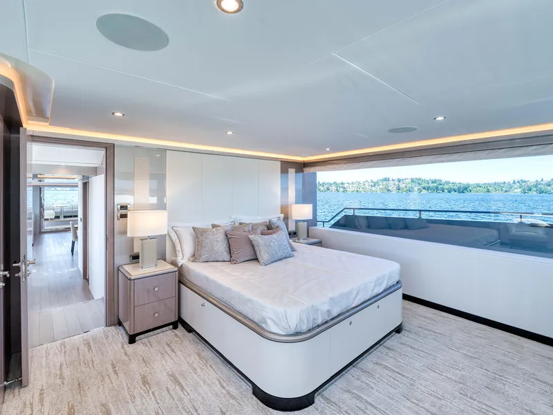 Slide: The Image of Luxurious bedroom interior of 2024 Ocean Alexander 32L yacht with large windows and modern decor. - 10