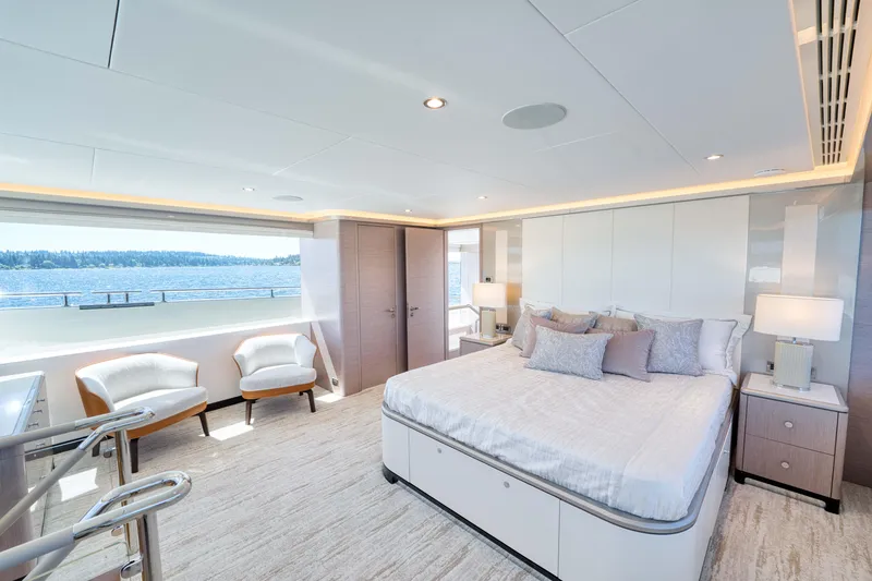 Slide: The Image of Luxurious master bedroom on the 2024 Ocean Alexander 32L yacht with ocean view. - 11