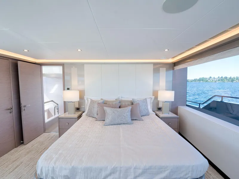 Slide: The Image of Luxurious bedroom on the 2024 Ocean Alexander 32L yacht with ocean view. - 12
