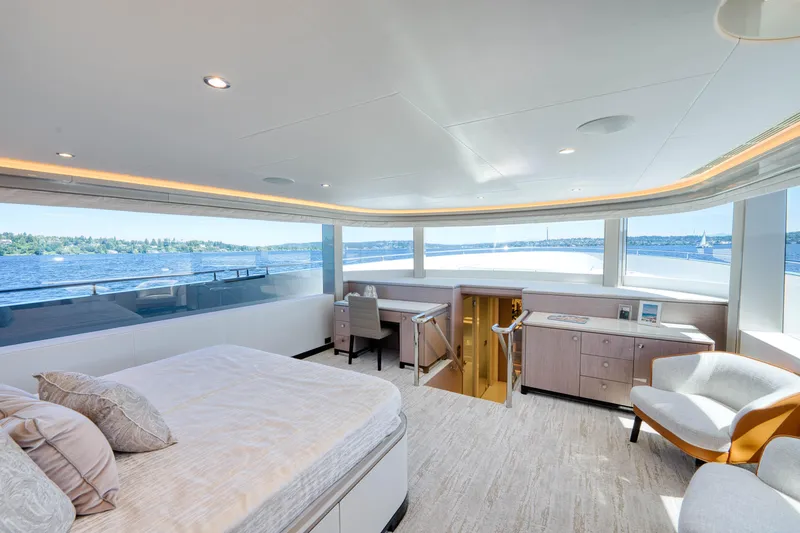 Slide: The Image of Luxurious master bedroom on the 2024 Ocean Alexander 32L yacht with panoramic ocean views. - 13