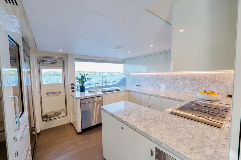 Slide: The Image of Modern kitchen interior on 2024 Ocean Alexander 32L yacht with ocean view. - 14