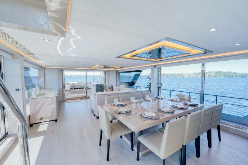 Slide: The Image of Luxurious dining area on the 2024 Ocean Alexander 32L yacht with panoramic ocean views. - 16