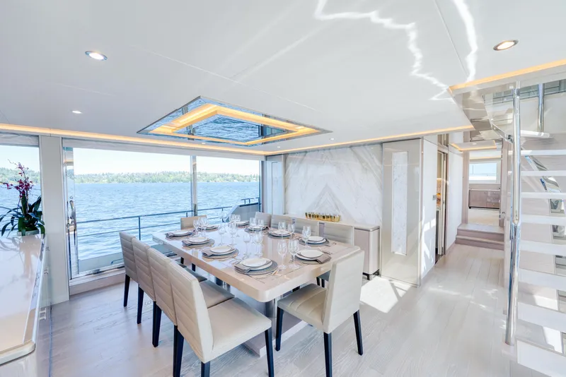 Slide: The Image of Luxurious dining area on the 2024 Ocean Alexander 32L yacht with ocean view. - 18