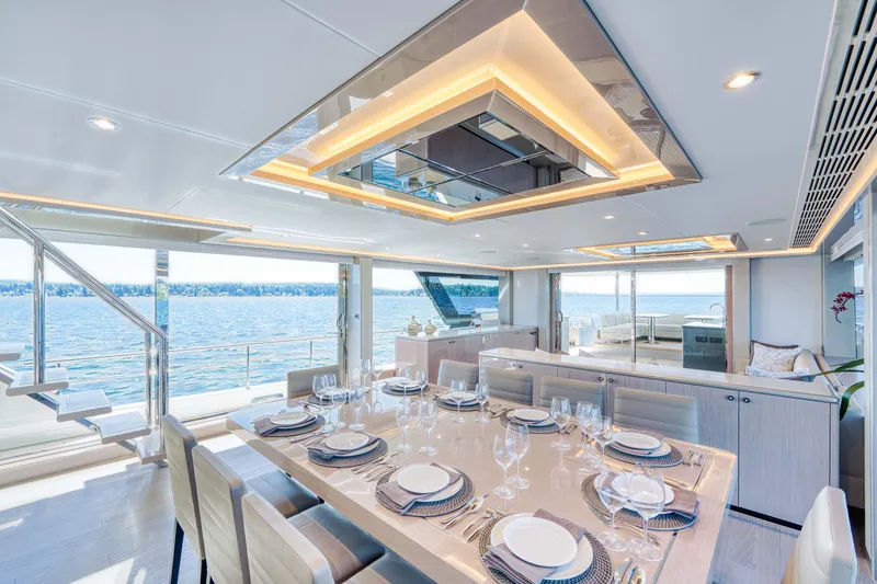 Slide: The Image of Luxurious dining area on the 2024 Ocean Alexander 32L yacht with ocean views. - 21