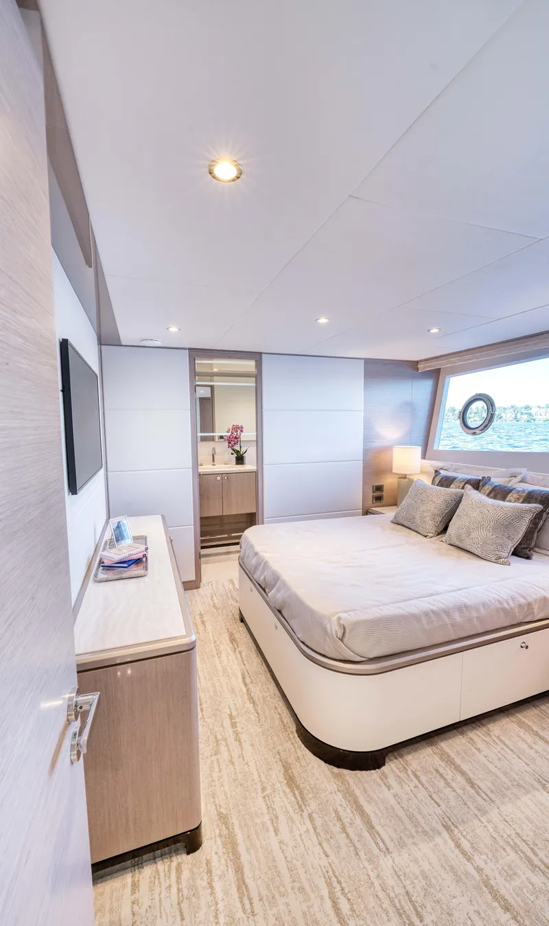 Slide: The Image of Luxurious bedroom interior of 2024 Ocean Alexander 32L yacht with modern decor. - 23