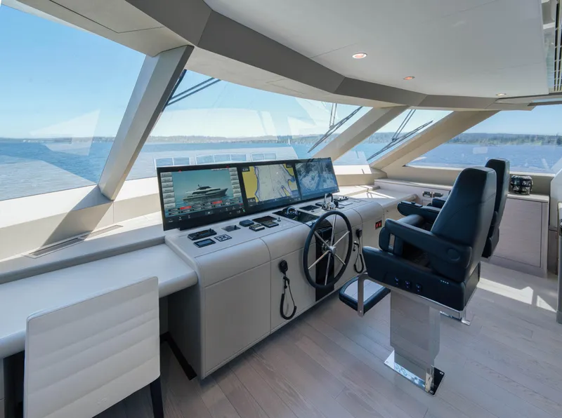 Slide: The Image of Modern helm station of the 2024 Ocean Alexander 32L yacht with panoramic windows. - 26