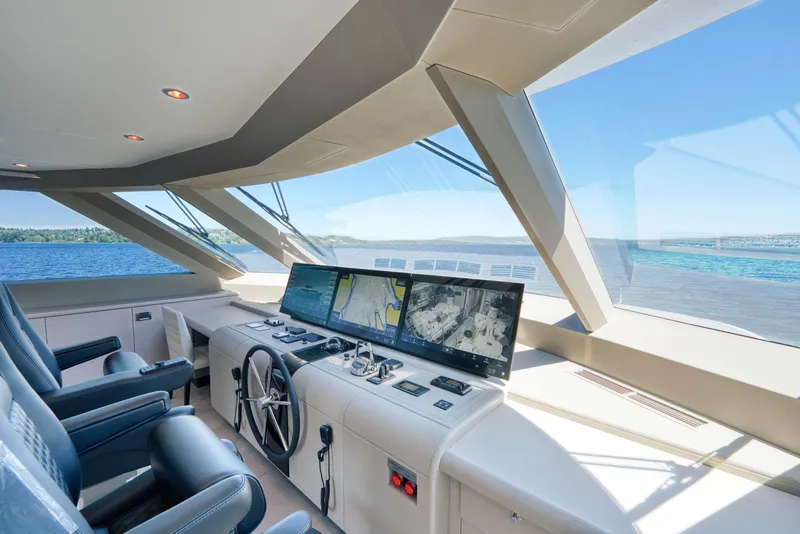Slide: The Image of Modern helm station of the 2024 Ocean Alexander 32L yacht with panoramic views. - 27