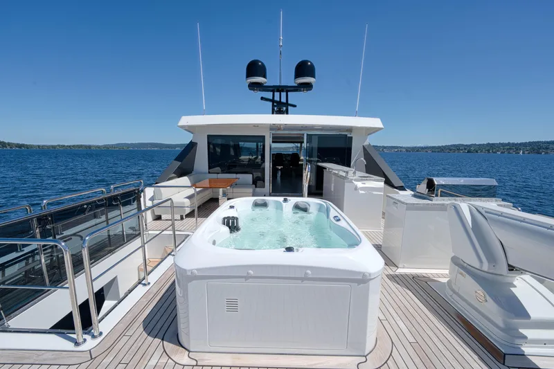 Slide: The Image of 2024 Ocean Alexander 32L yacht with hot tub on deck. - 32