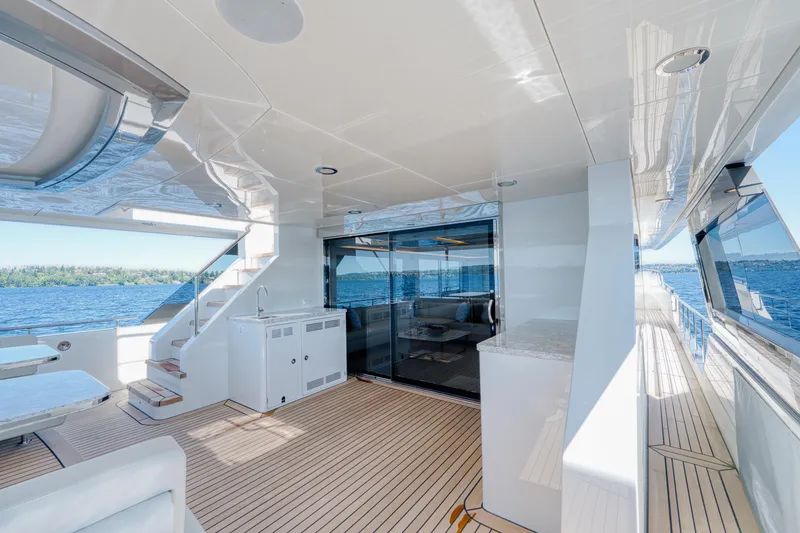 Slide: The Image of 2024 Ocean Alexander 32L yacht deck with modern amenities and ocean view. - 36