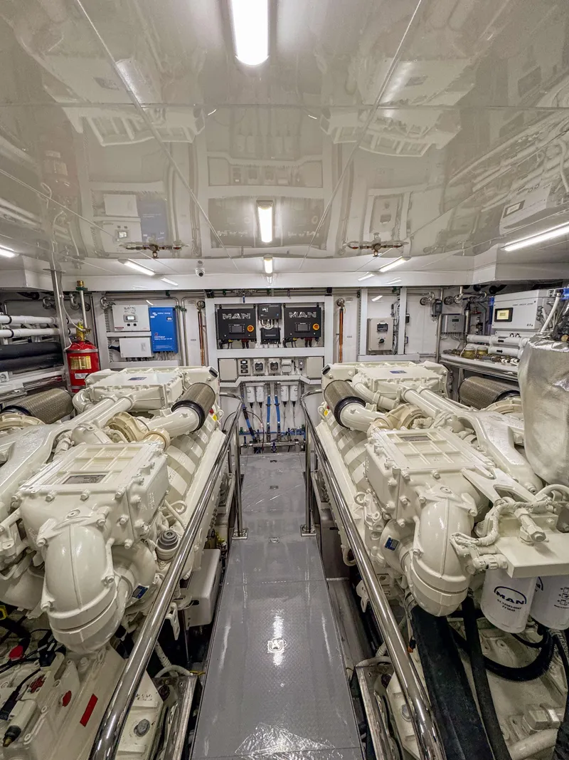 Slide: The Image of Engine room of a 2024 Ocean Alexander 32L yacht with dual engines. - 39
