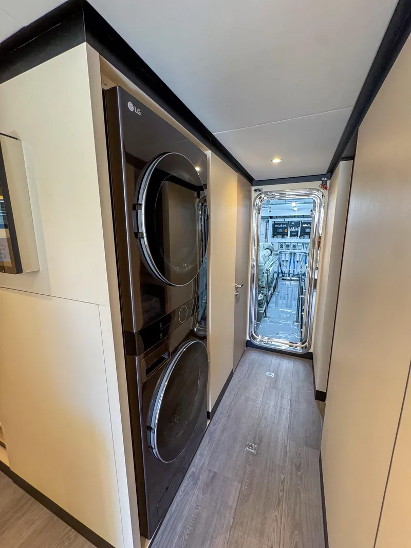 Slide: The Image of 2024 Ocean Alexander 32L yacht interior with stacked LG washer and dryer. - 42