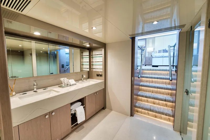 Slide: The Image of Luxurious bathroom in the 2024 Ocean Alexander 32L yacht with double sinks and modern design. - 6