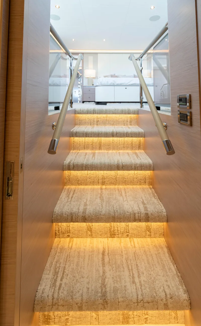 Slide: The Image of Luxurious illuminated staircase on the 2024 Ocean Alexander 32L yacht. - 8