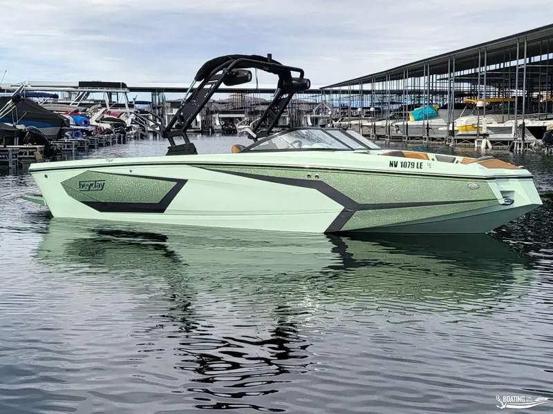 Slide: The Image of 2022 Heyday WT-Surf boat docked in marina, featuring sleek design and modern aesthetics. - 0