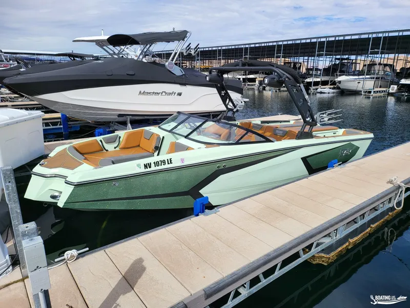 Slide: The Image of 2022 Heyday WT-Surf boat docked at marina, featuring sleek design and modern amenities. - 6
