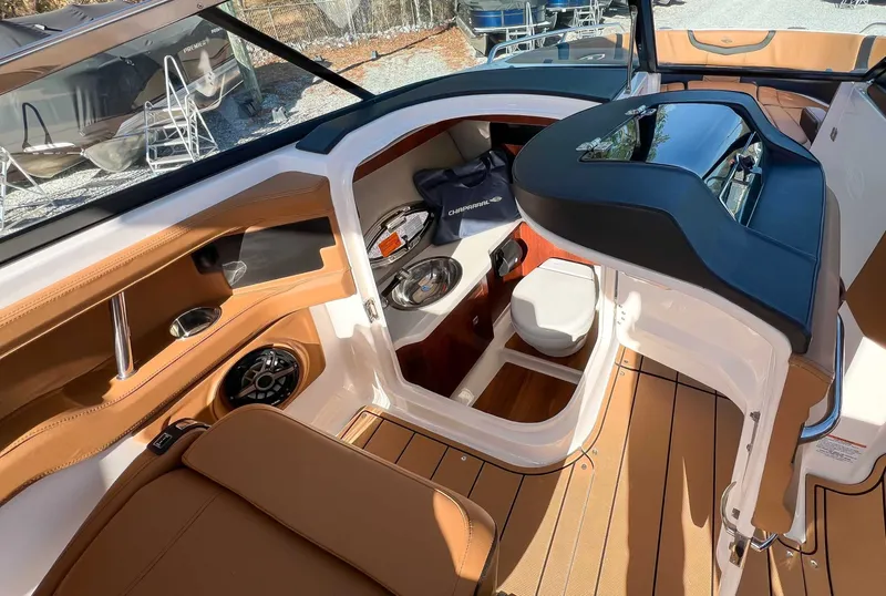 Slide: The Image of Interior of 2024 Chaparral 307 SSX with brown leather seating. - 24