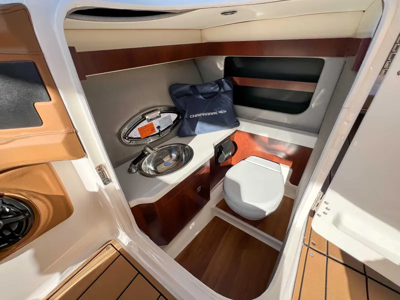 Slide: The Image of Interior of 2024 Chaparral 307 SSX with toilet and sink. - 25