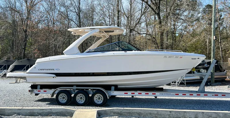 Slide: The Image of 2024 Chaparral 307 SSX boat on trailer outdoors. - 6