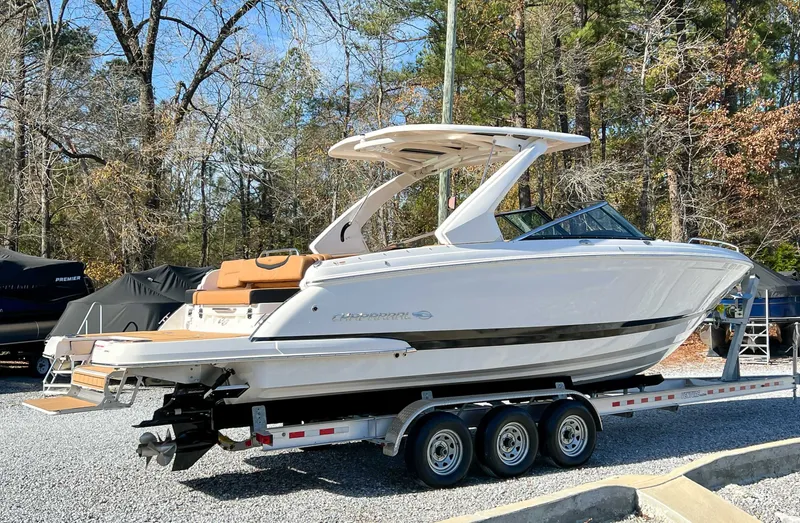 Slide: The Image of 2024 Chaparral 307 SSX boat on trailer outdoors. - 8