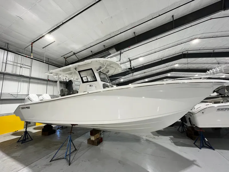The Image of 2024 Sea Pro 322 DLX boat in indoor storage facility. - 0
