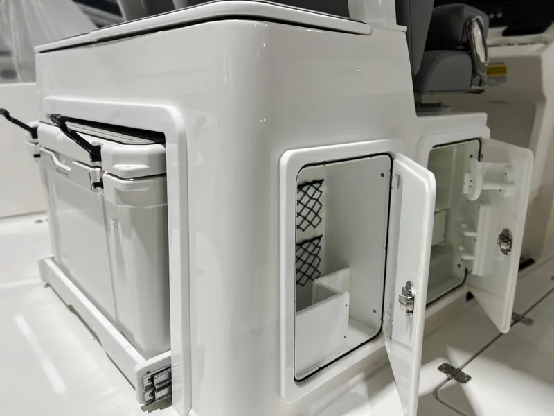 Slide: The Image of 2024 Sea Pro 322 DLX boat storage compartments and cooler. - 12