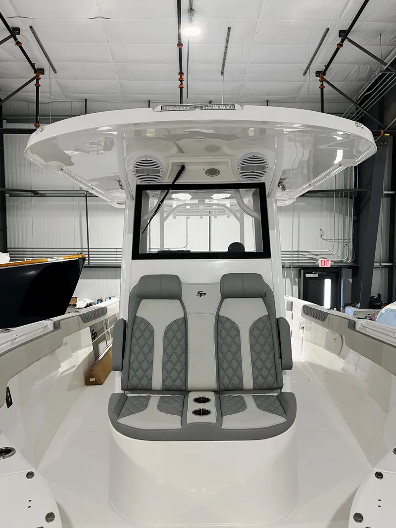 Slide: The Image of 2024 Sea Pro 322 DLX boat interior with dual seating and modern design. - 13