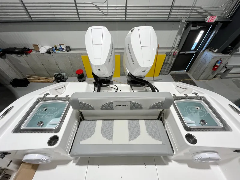 Slide: The Image of 2024 Sea Pro 322 DLX boat with dual outboard motors and spacious deck. - 3