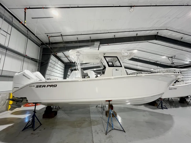 Slide: The Image of 2024 Sea Pro 322 DLX boat in a storage facility. - 5