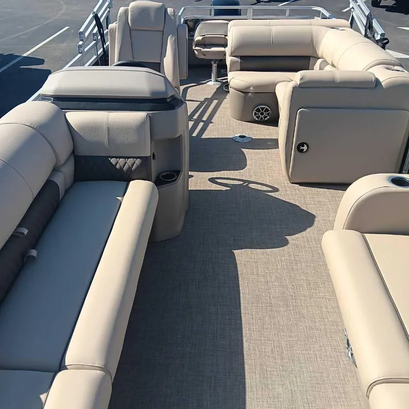 Slide: The Image of Interior of 2024 Sun Tracker SportFish 22 DLX pontoon boat with beige seating. - 4