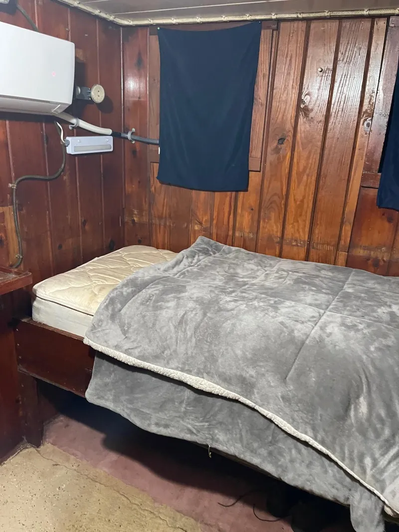 Slide: The Image of Cozy wooden cabin bedroom in a 1961 Commercial Model Bow Tug boat. - 22