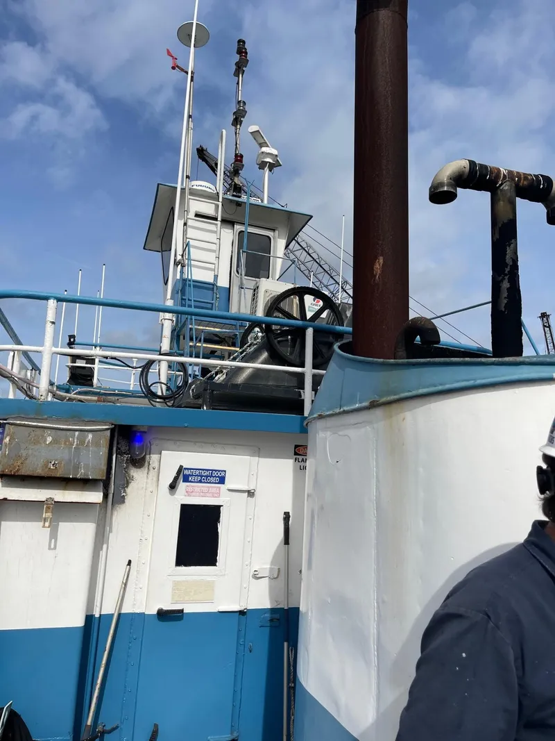 Slide: The Image of 1961 Commercial Model Bow Tugboat with blue and white exterior. - 6