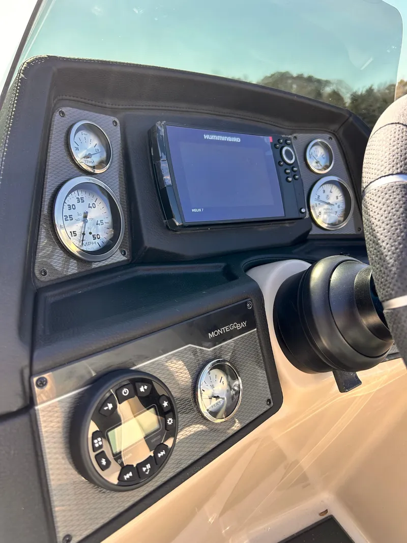 Slide: The Image of Montego Bay 8520 boat dashboard with gauges and navigation system, 2023 model. - 8