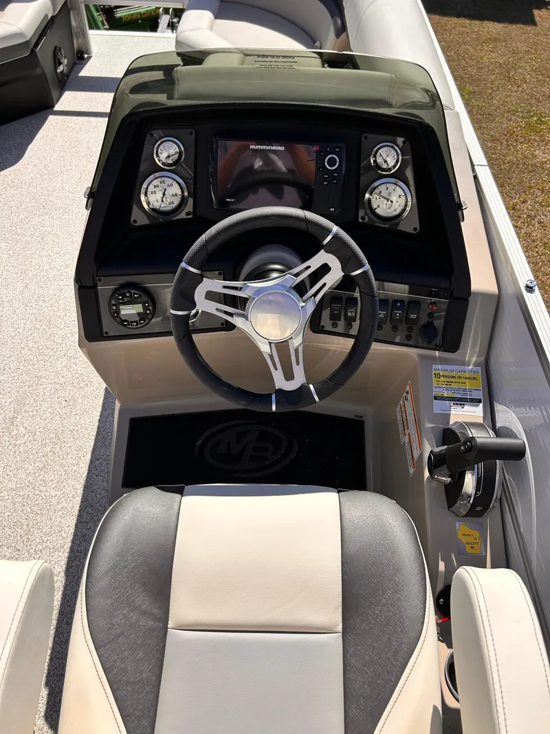 Slide: The Image of 2023 Montego Bay 8520 boat dashboard with steering wheel and gauges. - 9