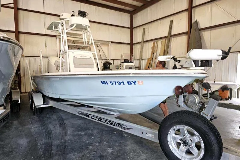 Slide: The Image of 2016 Avenger 26 boat on trailer in storage facility. - 2