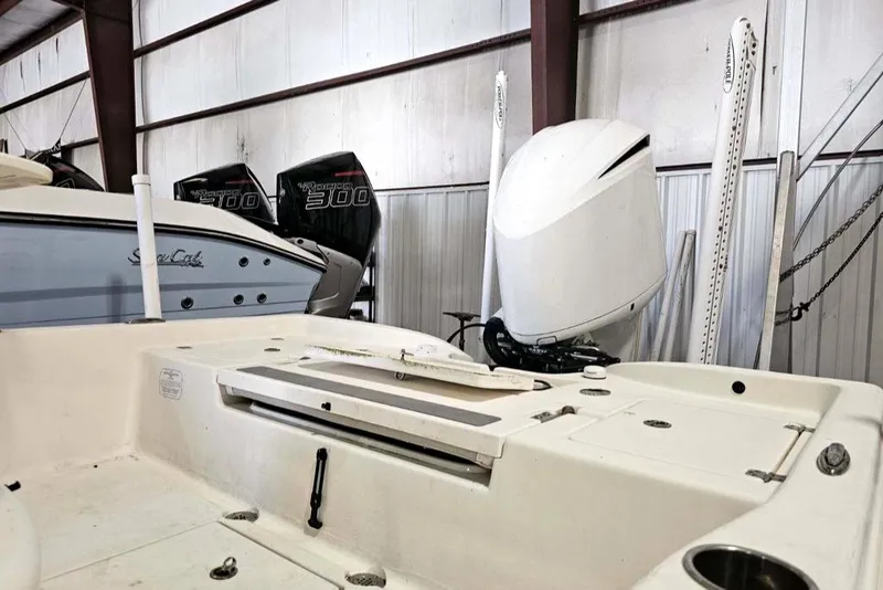 Slide: The Image of 2016 Avenger 26 boat in storage with powerful outboard engines. - 5
