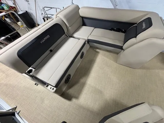 Slide: The Image of 2024 Harris Cruiser 210 interior with beige seating and black accents. - 11