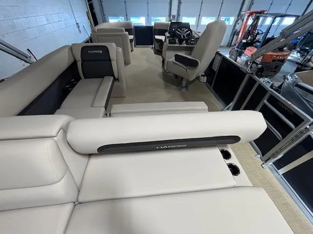 Slide: The Image of 2024 Harris Cruiser 210 interior with beige seating and modern helm. - 17