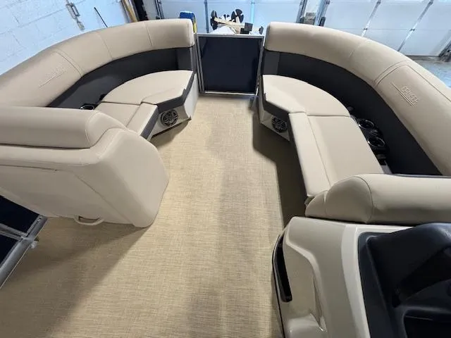 Slide: The Image of 2024 Harris Cruiser 210 interior with beige seating and spacious layout. - 25
