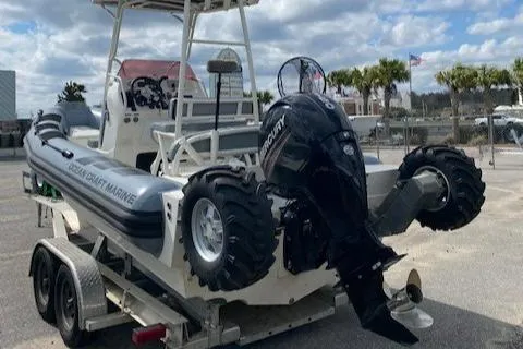 Slide: The Image of 2020 Ocean Craft Marine 24 boat on trailer with Mercury outboard motor. - 10