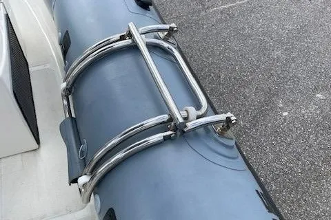 Slide: The Image of Close-up of Ocean Craft Marine 24 boat's railing, 2020 model, featuring sturdy metal construction. - 13