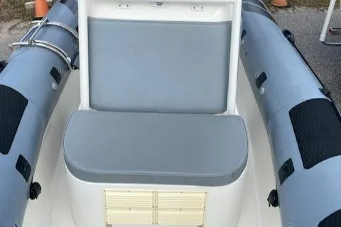 Slide: The Image of 2020 Ocean Craft Marine 24 boat interior with gray seating and inflatable sides. - 14