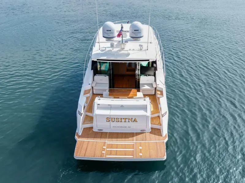 Slide: The Image of 2022 Tiara Yachts 53 Coupe on water, rear view. - 17